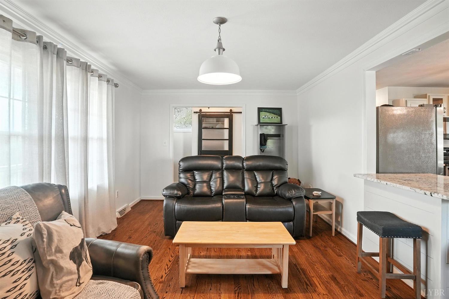 1348 Salem Road Spout Spring, VA 24593 - Photo 24 of 89 a living room with furniture and a flat screen tv