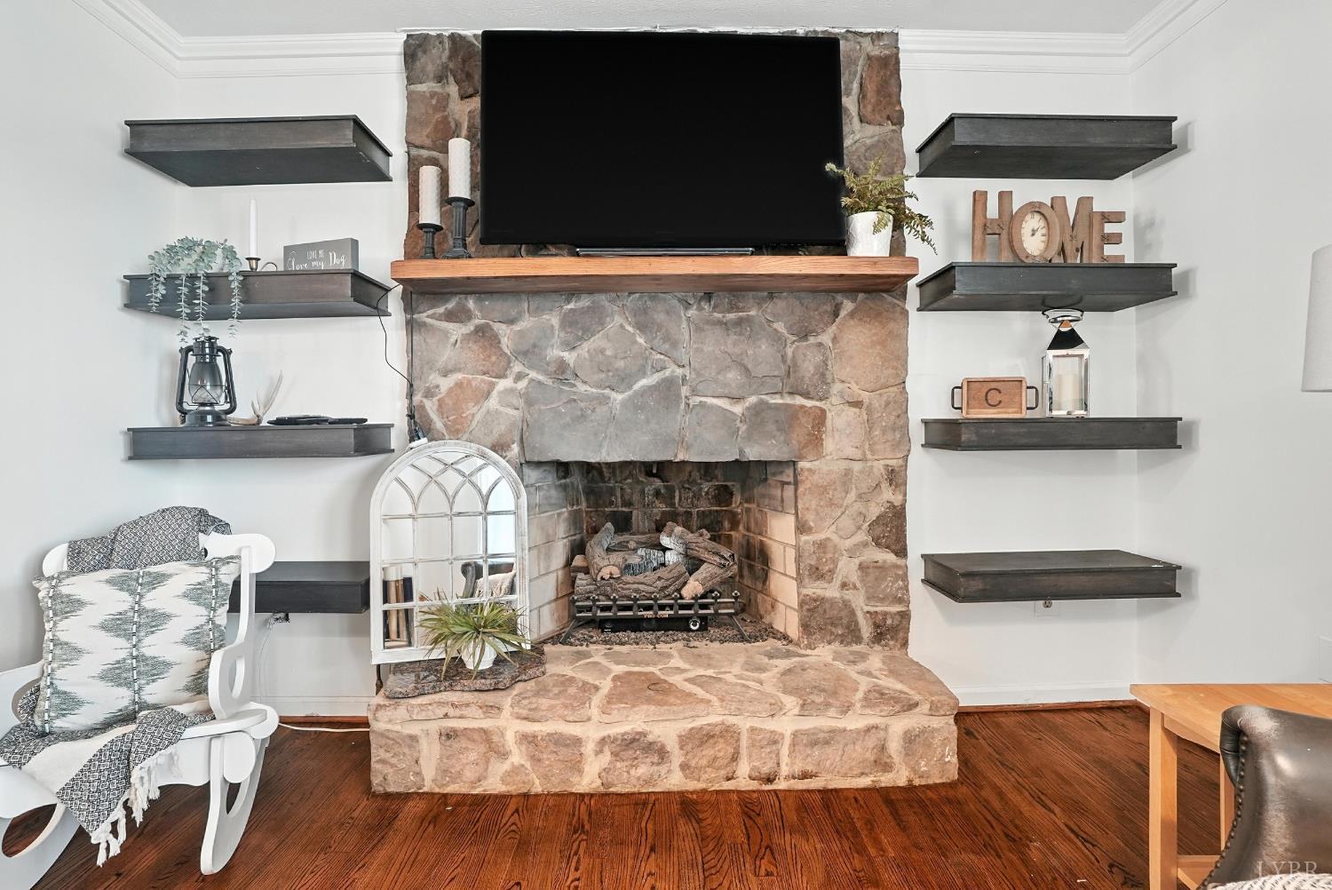 1348 Salem Road Spout Spring, VA 24593 - Photo 27 of 89 a living room with furniture and a fireplace