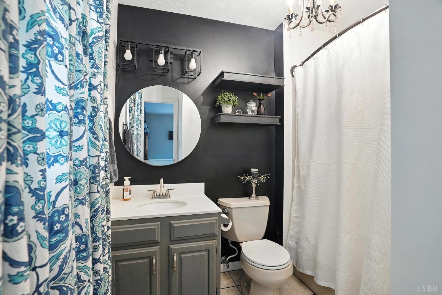 1348 Salem Road Spout Spring, VA 24593 - Photo 31 of 89 a bathroom with a toilet sink vanity and mirror