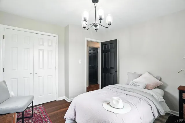 a living room with lots of furniture and kitchen view