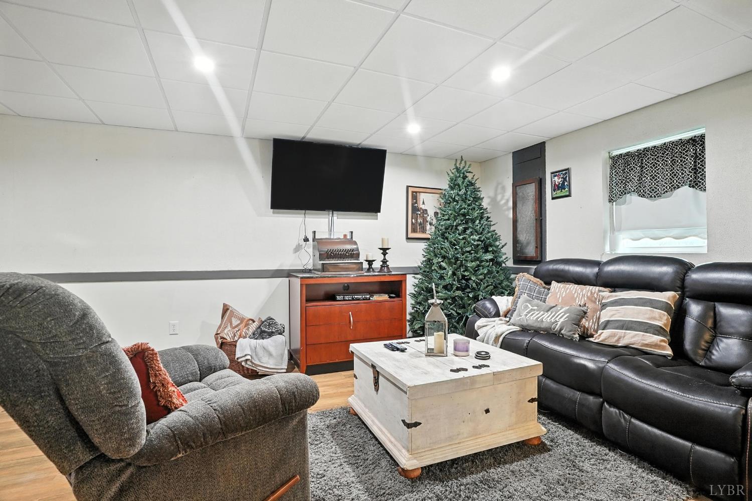 1348 Salem Road Spout Spring, VA 24593 - Photo 35 of 89 a living room with furniture and a flat screen tv