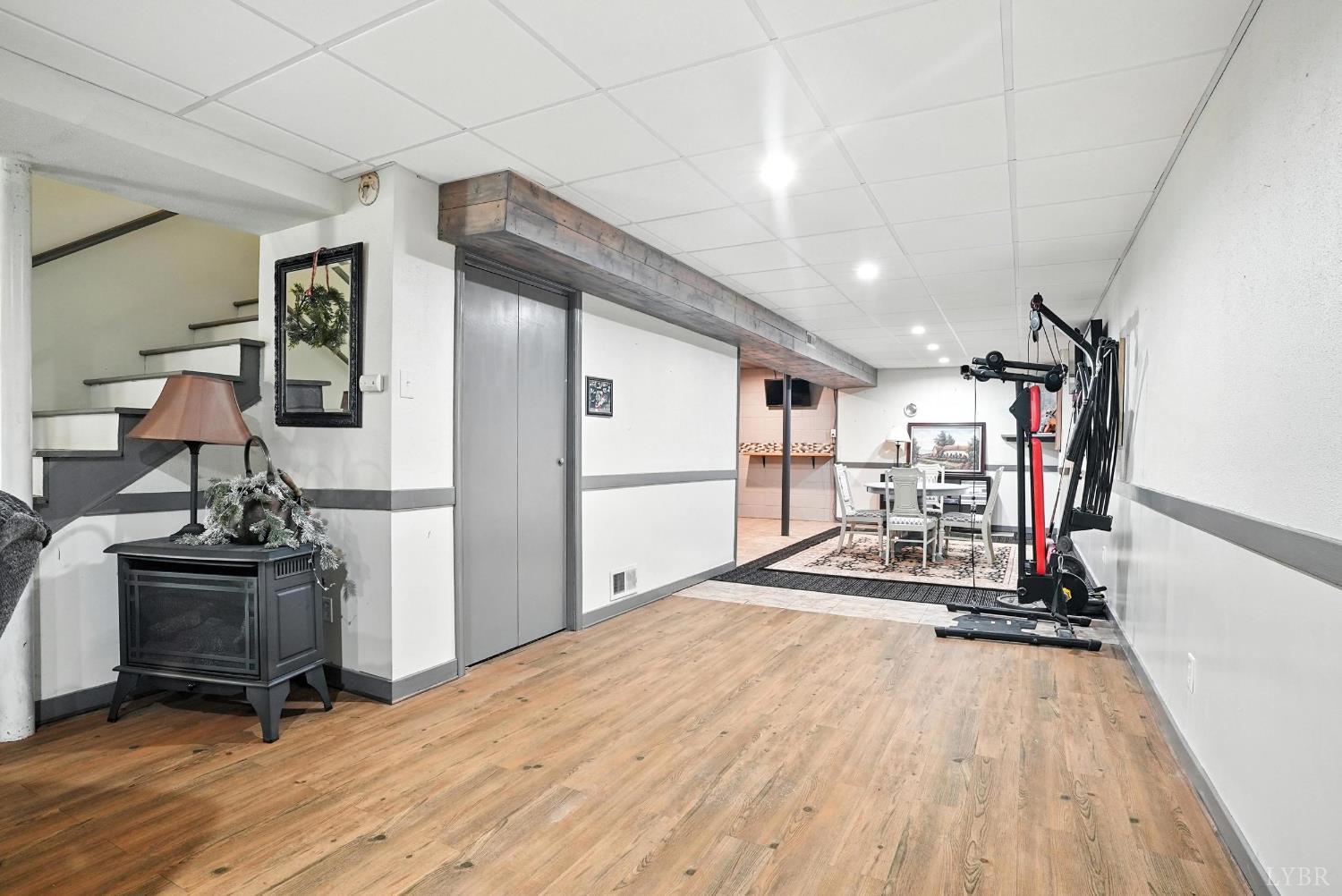 1348 Salem Road Spout Spring, VA 24593 - Photo 36 of 89 a view of a room with gym equipment and floor to ceiling window