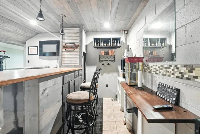 an aerial view of a house with a yard and outdoor seating