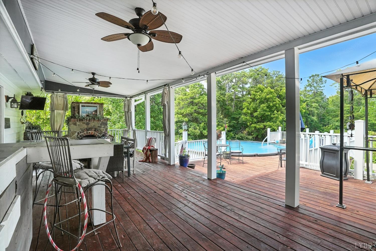 1348 Salem Road Spout Spring, VA 24593 - Photo 42 of 89 a view of a dining room with furniture large windows and wooden floor