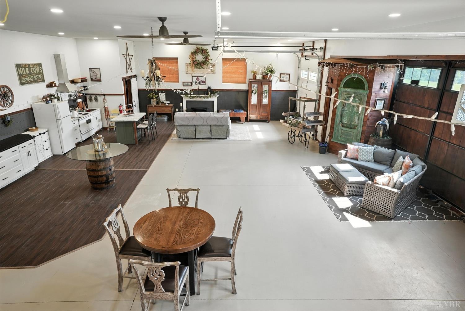 1348 Salem Road Spout Spring, VA 24593 - Photo 48 of 89 a living room with lots of furniture and a dining table