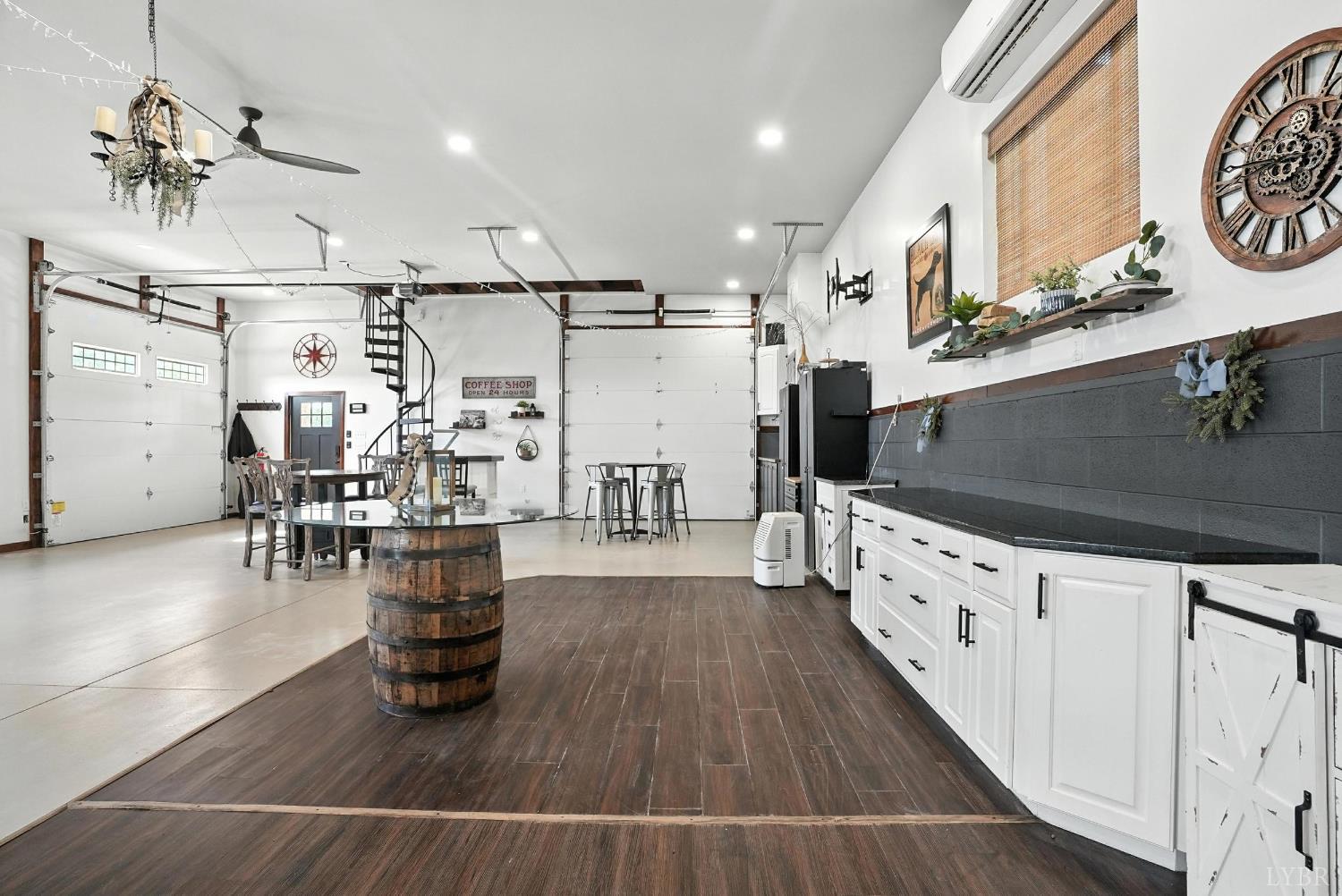 1348 Salem Road Spout Spring, VA 24593 - Photo 51 of 89 a living room with lots of wooden furniture and a chandelier
