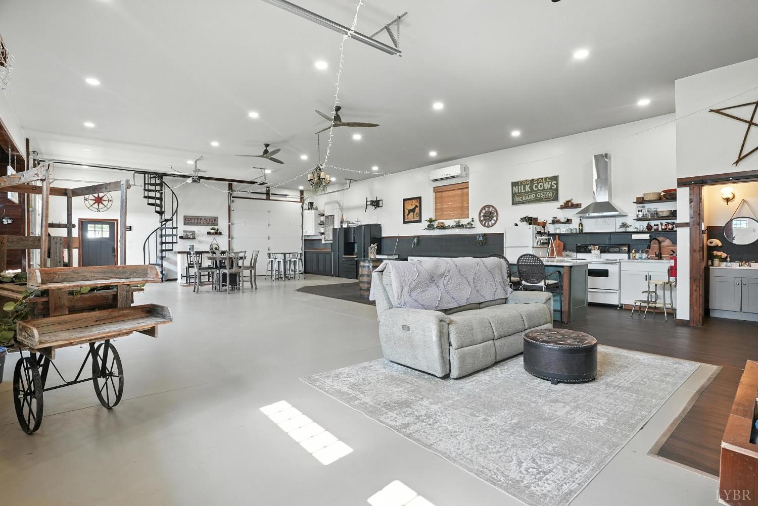 1348 Salem Road Spout Spring, VA 24593 - Photo 57 of 89 a living room with lots of furniture and kitchen view