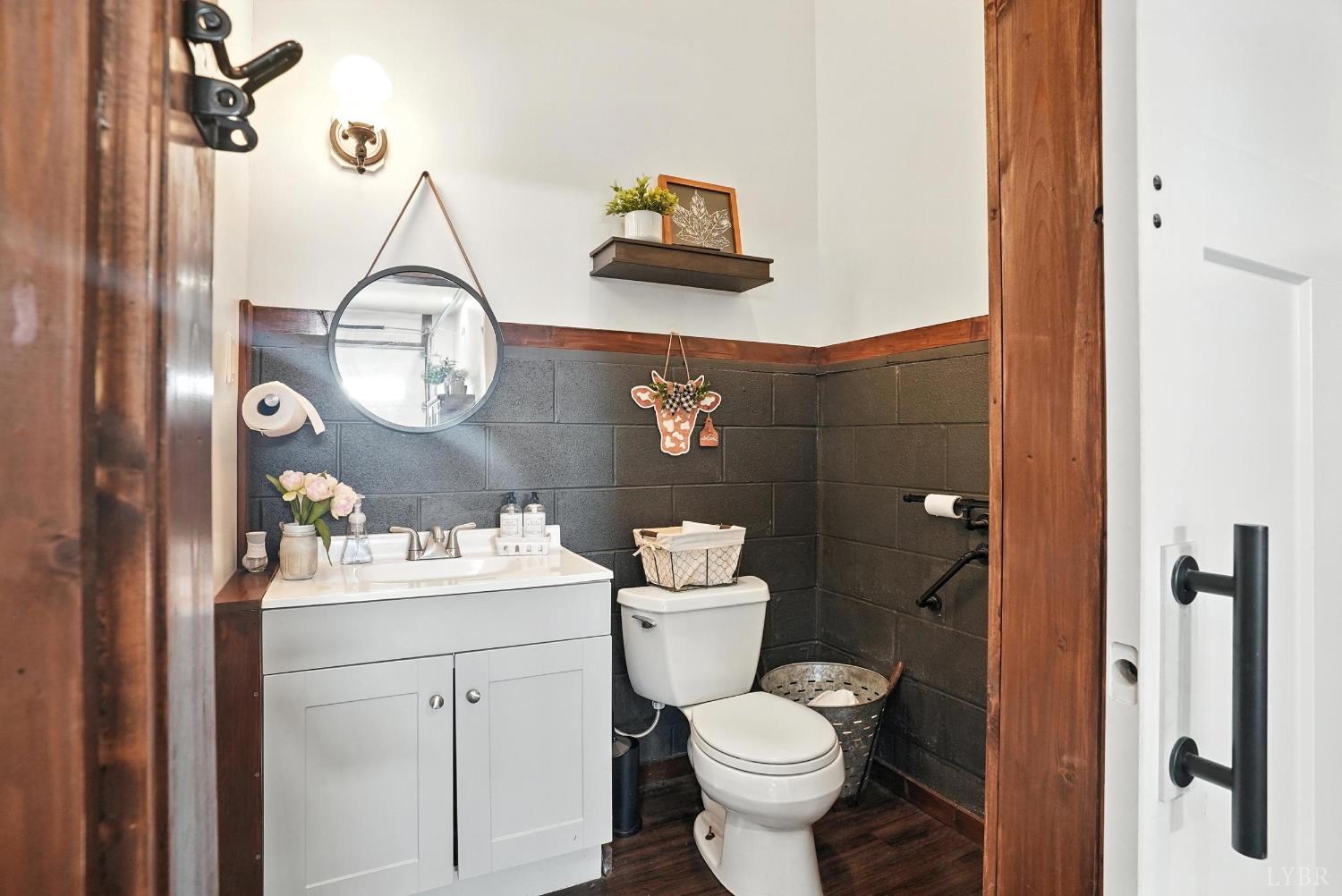 1348 Salem Road Spout Spring, VA 24593 - Photo 59 of 89 a bathroom with a sink toilet and vanity