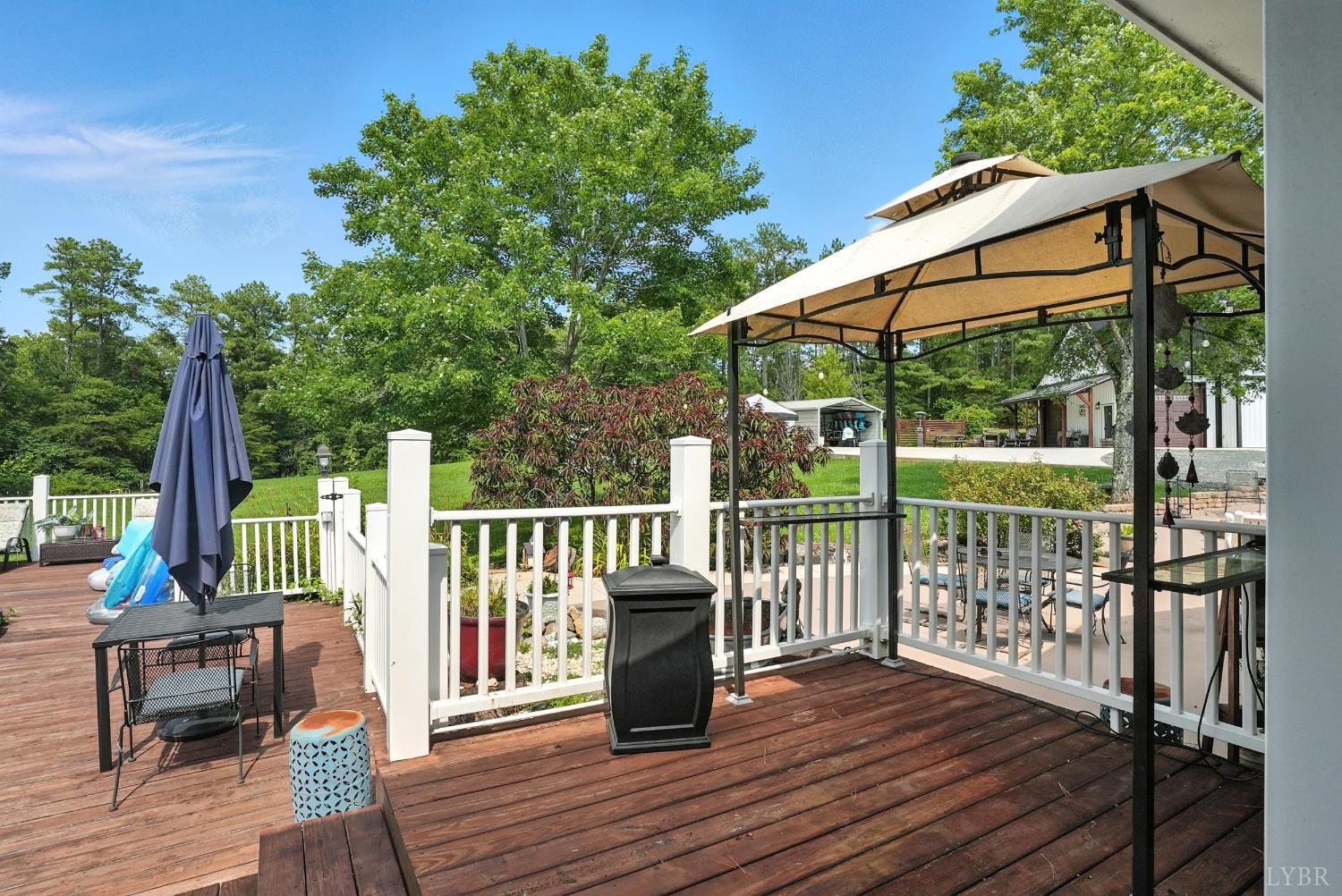 1348 Salem Road Spout Spring, VA 24593 - Photo 7 of 89 a view of balcony with wooden floor and outdoor seating