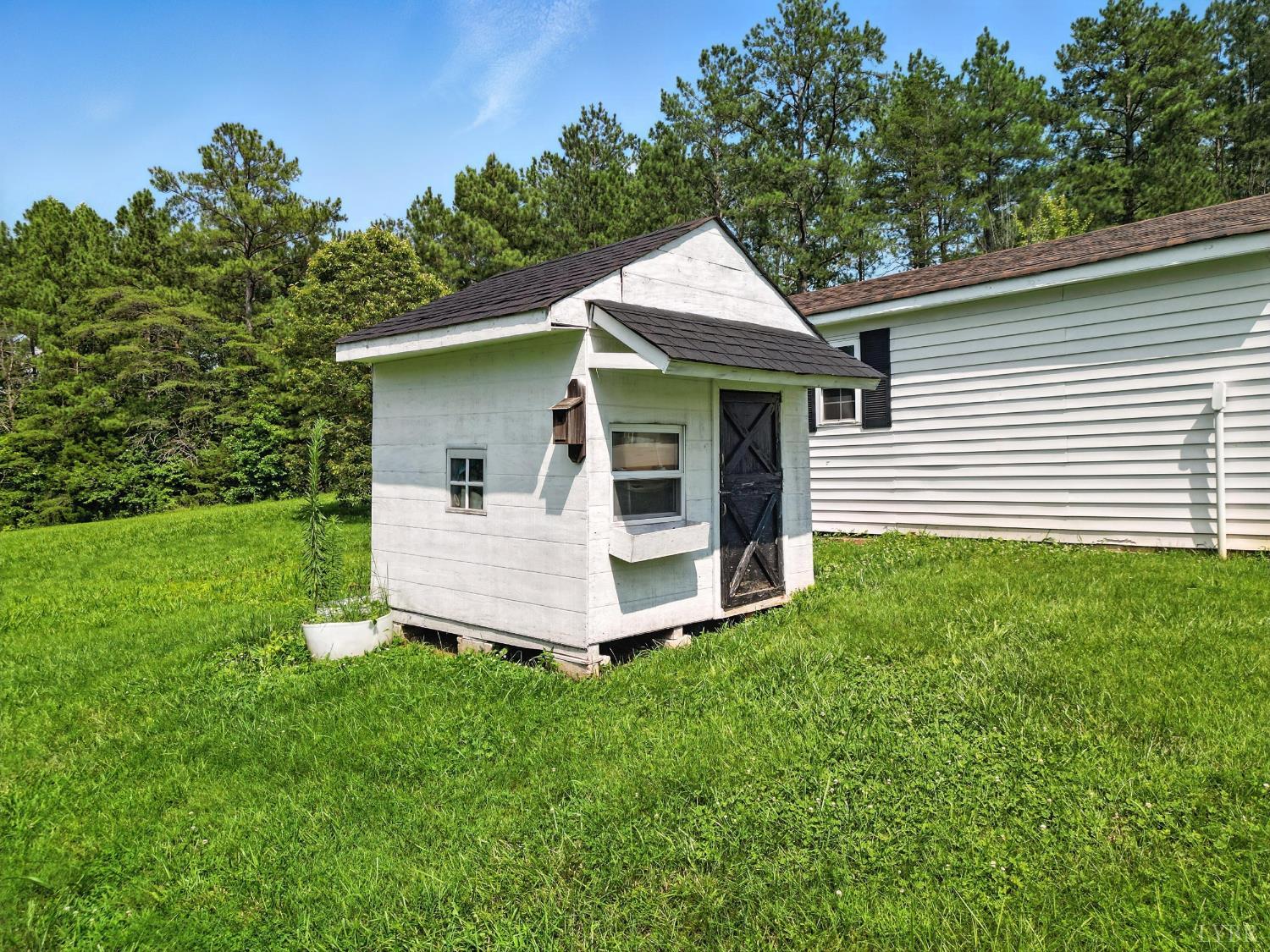 1348 Salem Road Spout Spring, VA 24593 - Photo 78 of 89 a view of a house with a yard and sitting area