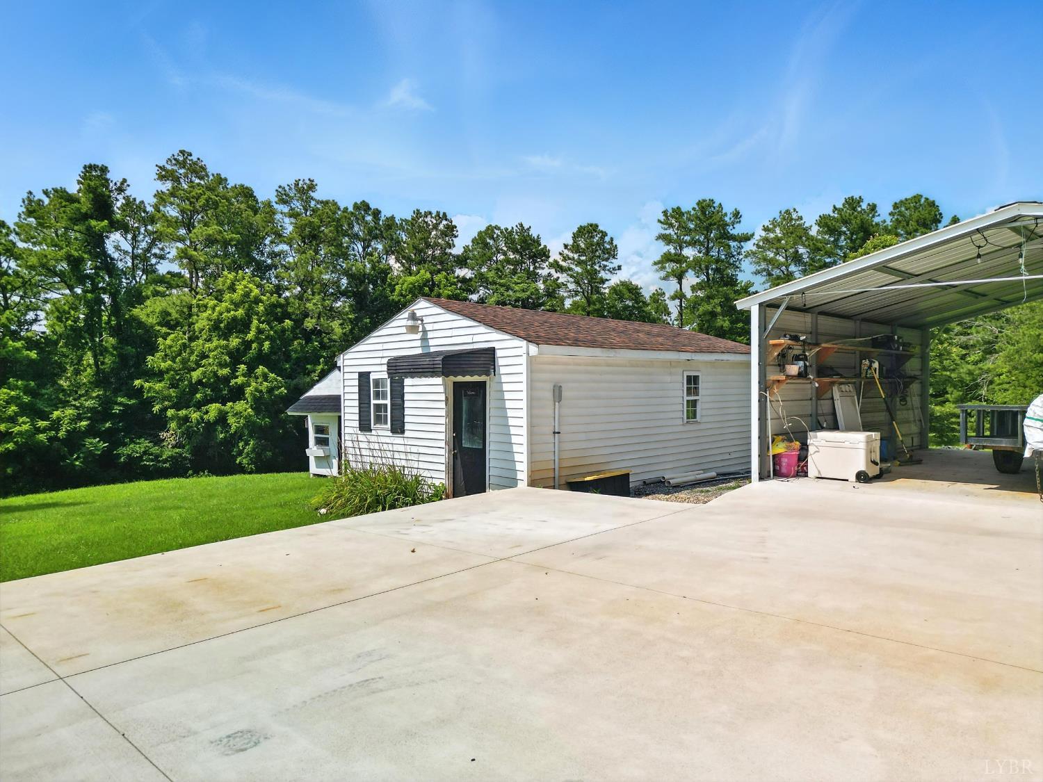 1348 Salem Road Spout Spring, VA 24593 - Photo 79 of 89 a front view of a house with a yard and garage