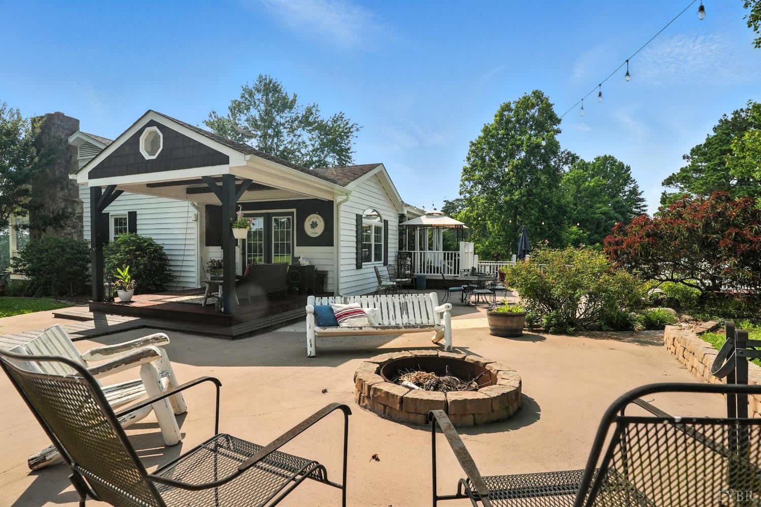 1348 Salem Road Spout Spring, VA 24593 - Photo 9 of 89 a view of a patio with table and chairs and potted plants