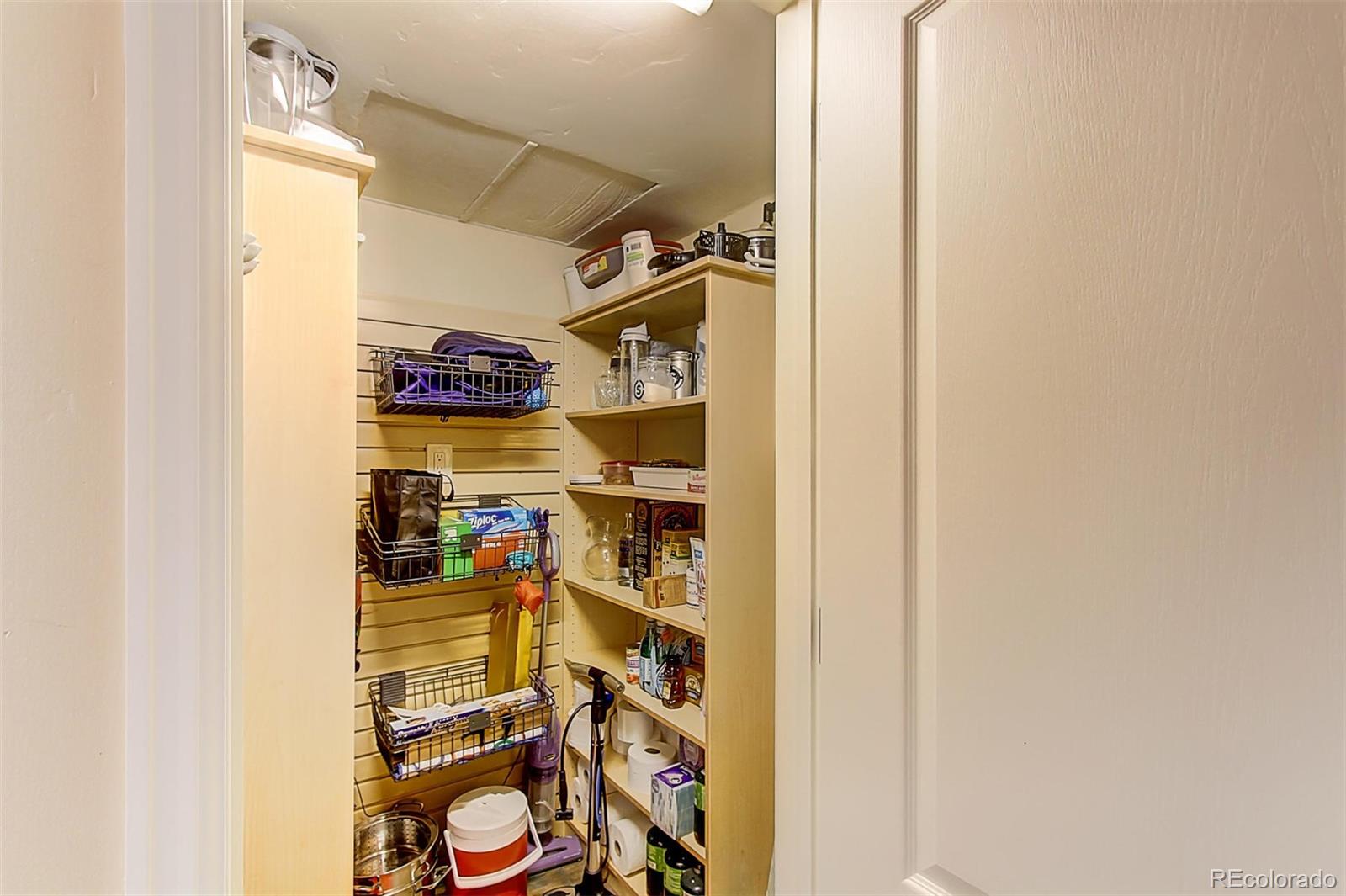 1020 15th Street, Unit 25J Denver, CO 80202 - Photo 18 of 34 a view of walk in closet with clothes and shoes