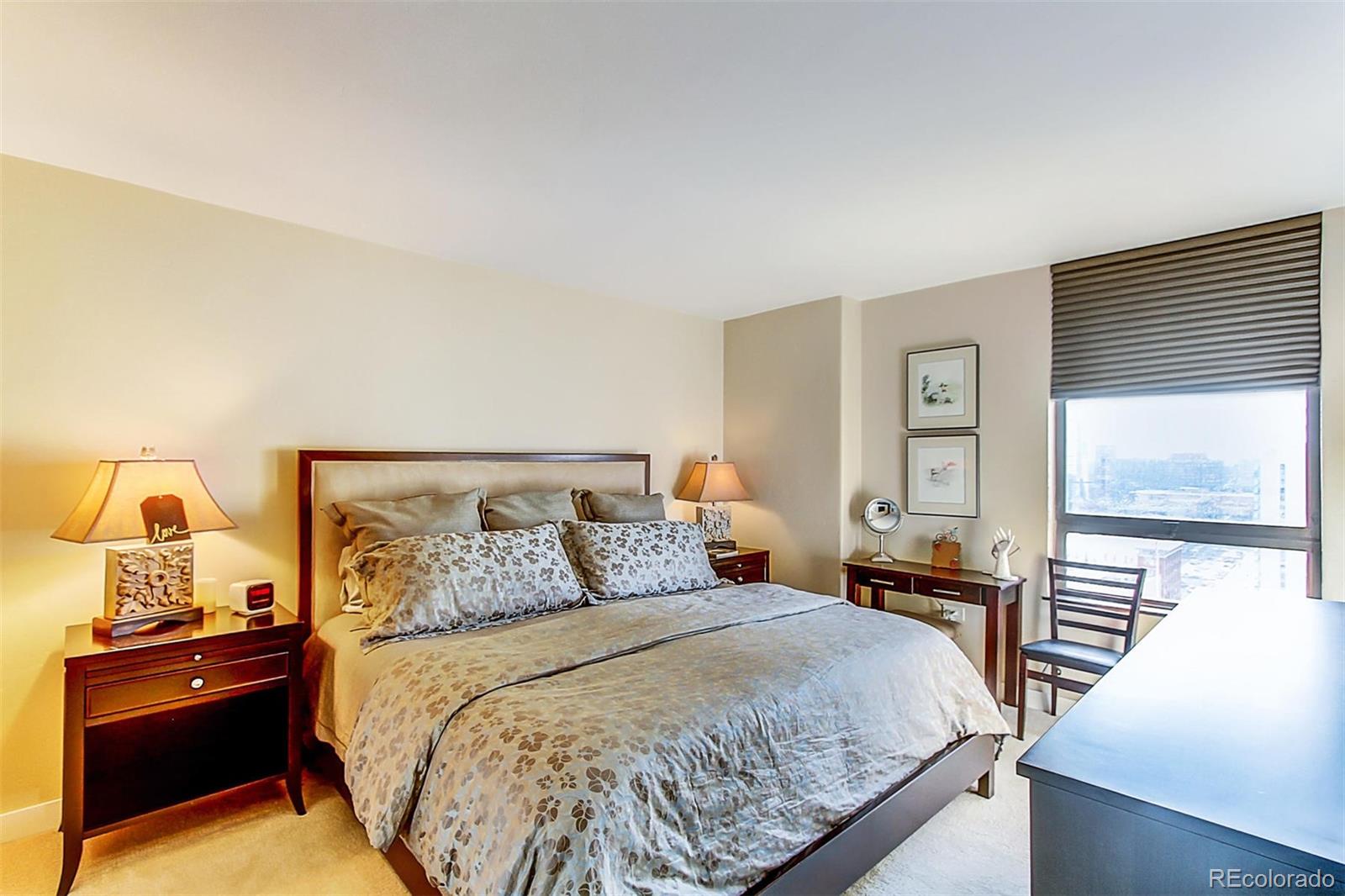 1020 15th Street, Unit 25J Denver, CO 80202 - Photo 22 of 34 a bedroom with a bed and window