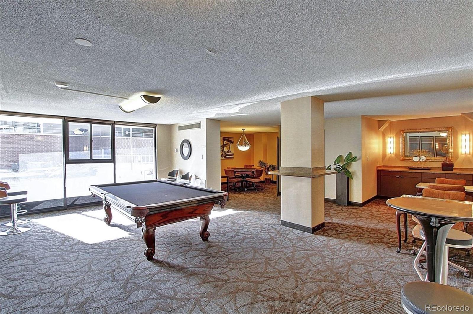 1020 15th Street, Unit 25J Denver, CO 80202 - Photo 33 of 34 a room with furniture pool table and windows