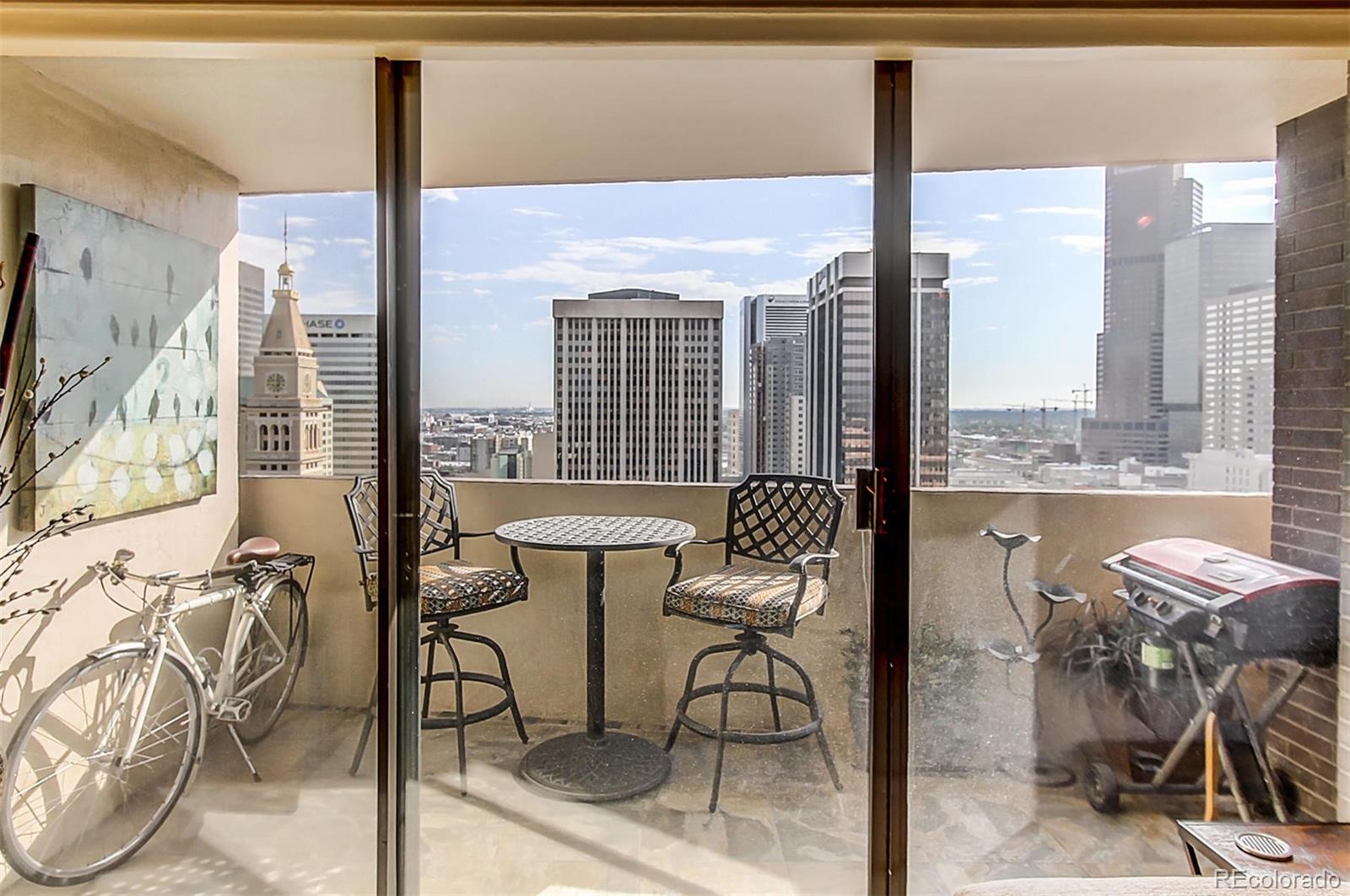 1020 15th Street, Unit 25J Denver, CO 80202 - Photo 7 of 34 a view of a dining room with furniture and a window