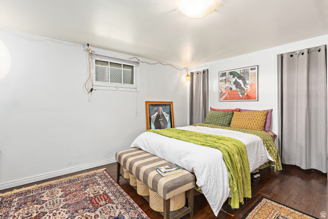 372 800 East Provo, UT 84606 - Photo 23 of 29 Room featuring dark wood-finish flooring, a flush-mount ceiling light fixture, and a window with security bars