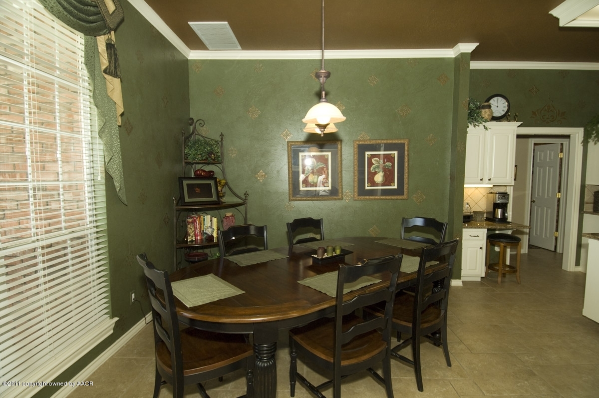 7821 Covington Parkway Amarillo, TX 79121 - Photo 14 of 53 a view of a dining room with furniture and chandelier