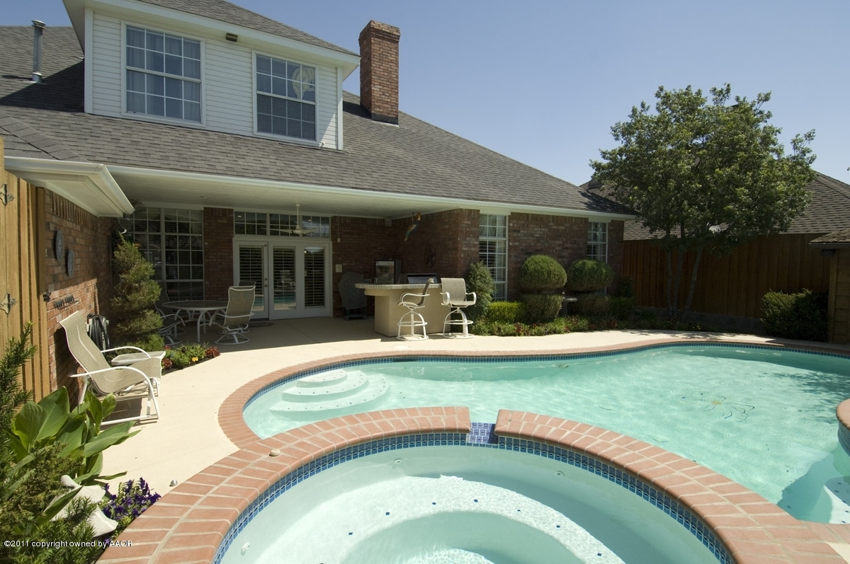7821 Covington Parkway Amarillo, TX 79121 - Photo 2 of 53 a swimming pool with outdoor seating and yard