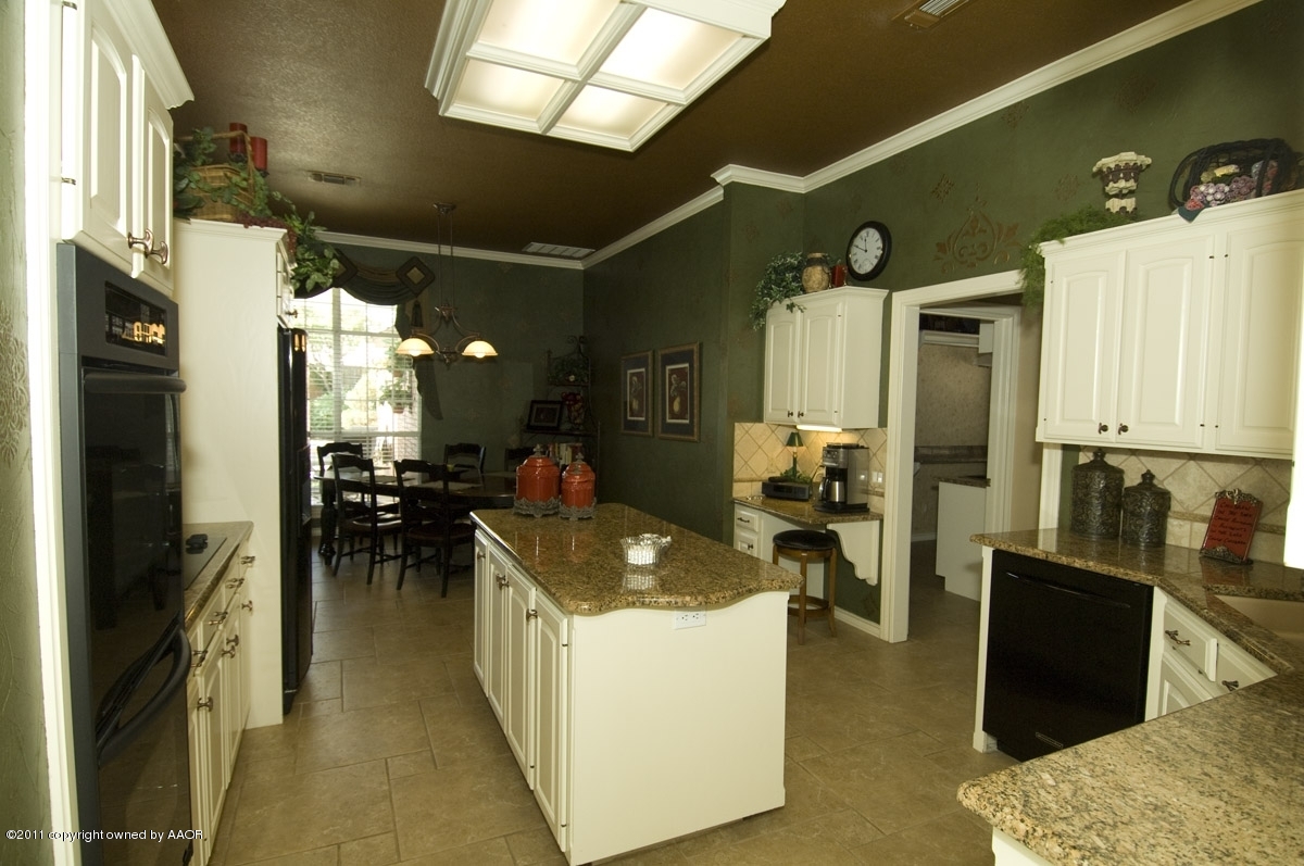 7821 Covington Parkway Amarillo, TX 79121 - Photo 23 of 53 a living room with furniture a dining table and a refrigerator