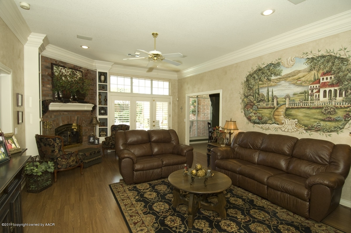 7821 Covington Parkway Amarillo, TX 79121 - Photo 31 of 53 a living room with furniture fireplace and a table