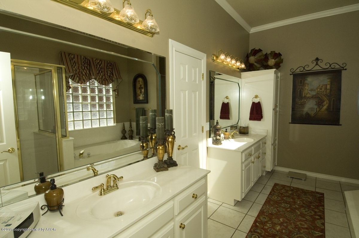 7821 Covington Parkway Amarillo, TX 79121 - Photo 36 of 53 a bathroom with a double vanity sink mirror and shower