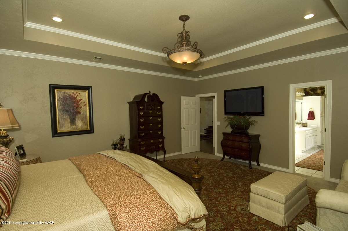 7821 Covington Parkway Amarillo, TX 79121 - Photo 37 of 53 a bedroom with a bed and a flat screen tv