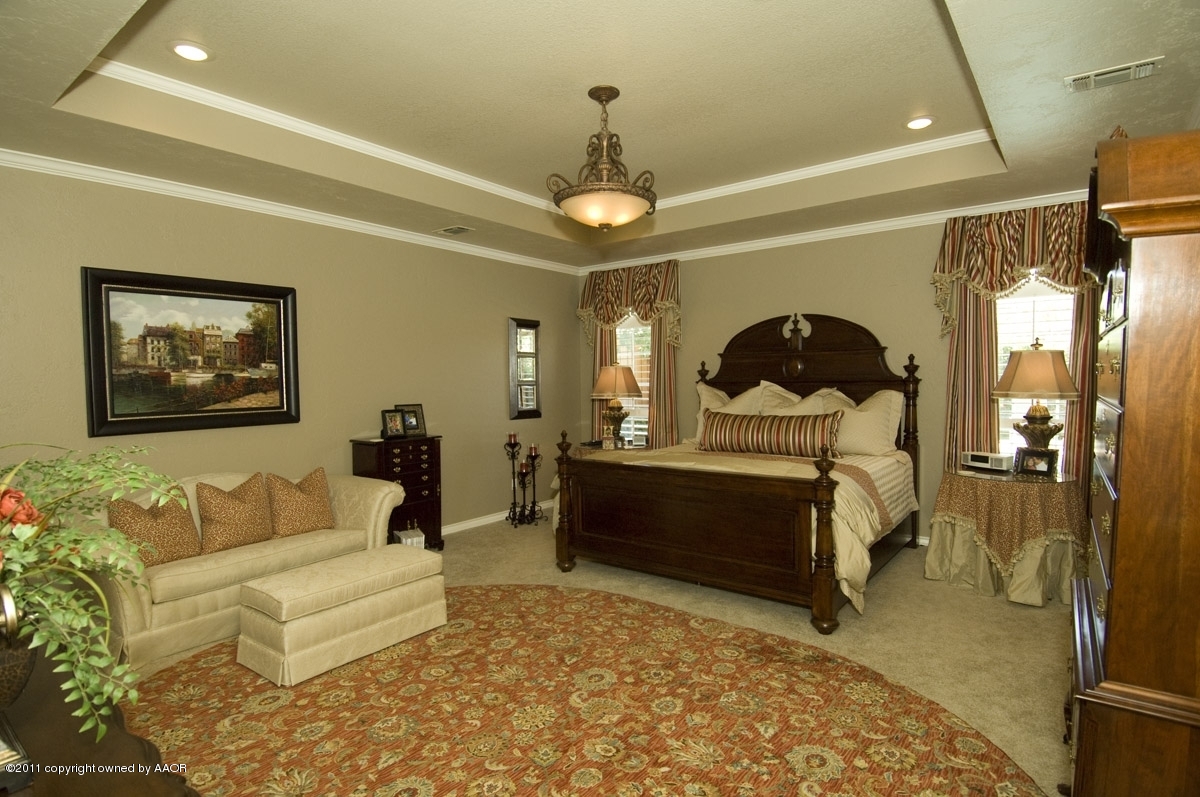 7821 Covington Parkway Amarillo, TX 79121 - Photo 38 of 53 a living room with furniture and a chandelier