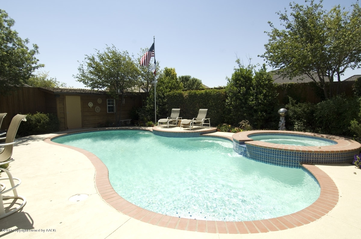 7821 Covington Parkway Amarillo, TX 79121 - Photo 45 of 53 a view of a swimming pool with a yard and plants