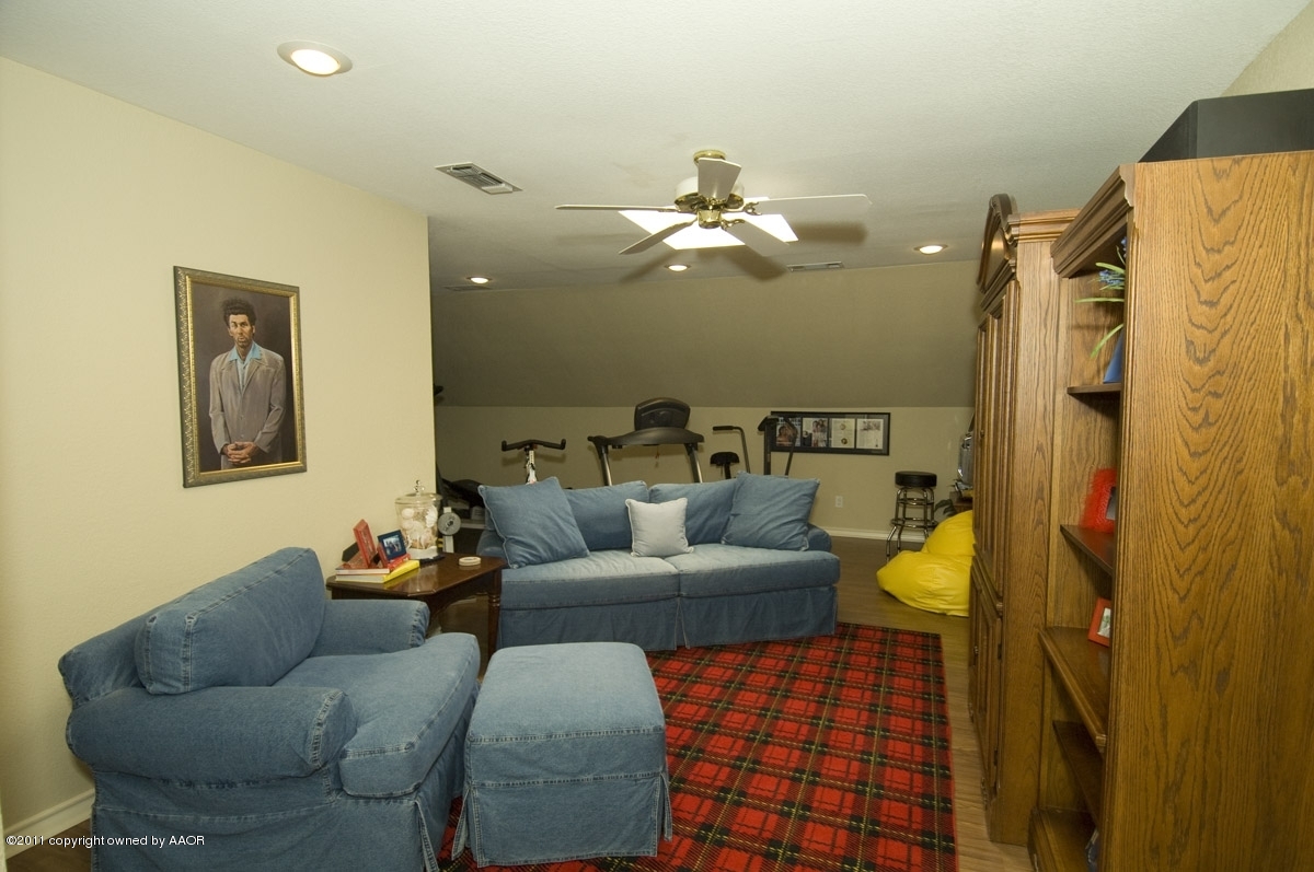7821 Covington Parkway Amarillo, TX 79121 - Photo 48 of 53 a living room with furniture and a chandelier