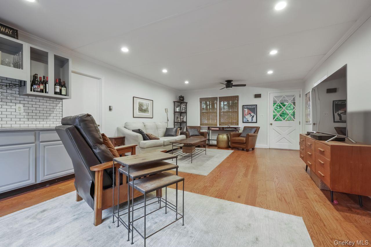 51 Knox Road Brewster, NY 10509 - Photo 14 of 31 a living room with furniture a flat screen tv and kitchen view
