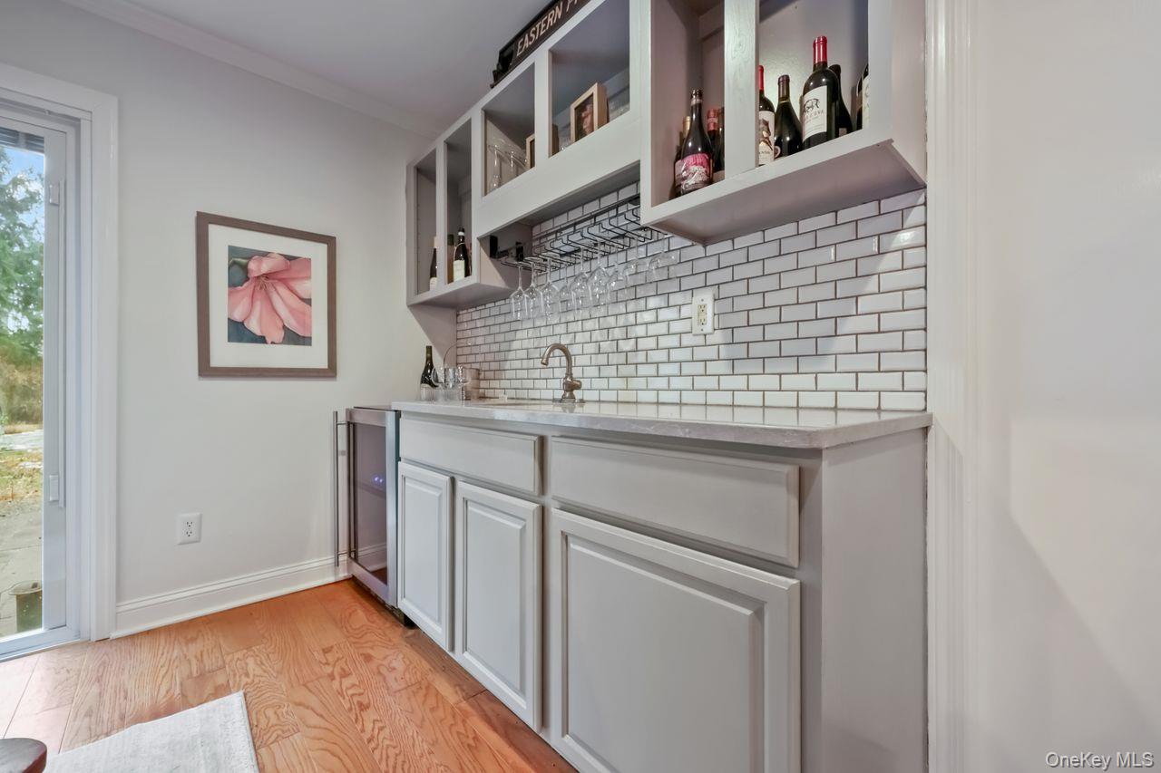 51 Knox Road Brewster, NY 10509 - Photo 15 of 31 a bathroom with a granite countertop sink and a window