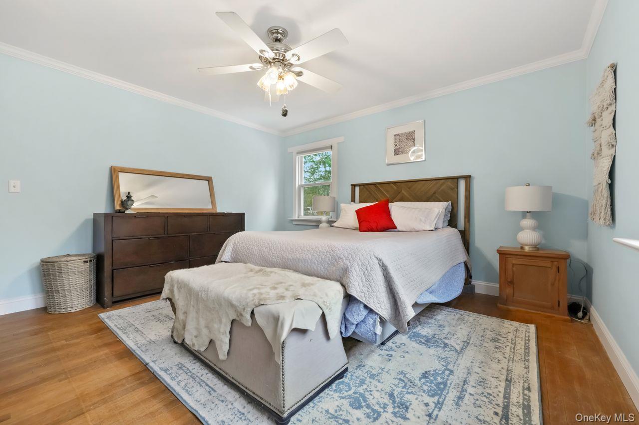 51 Knox Road Brewster, NY 10509 - Photo 17 of 31 a bedroom with a bed and wooden floor