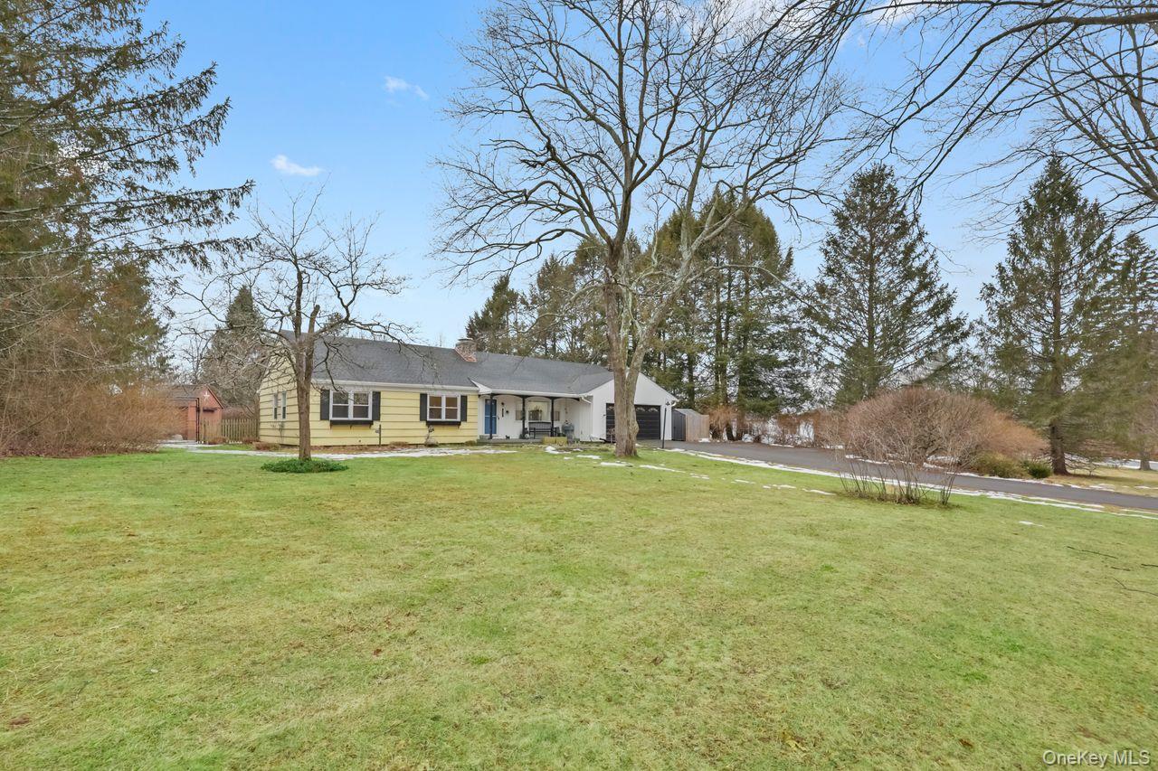 51 Knox Road Brewster, NY 10509 - Photo 2 of 31 a front view of a house with a garden