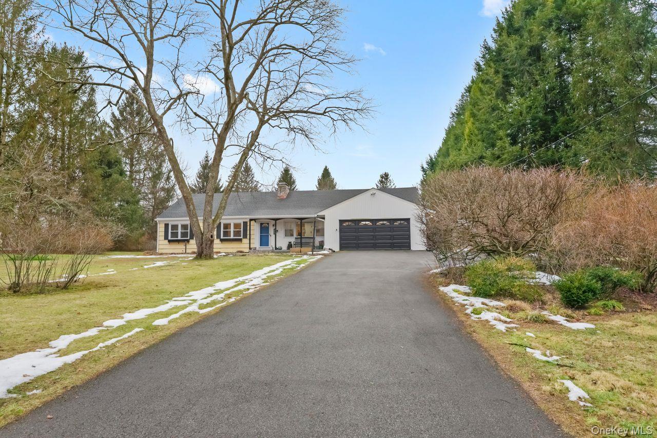51 Knox Road Brewster, NY 10509 - Photo 29 of 31 a front view of a house with a yard and garage