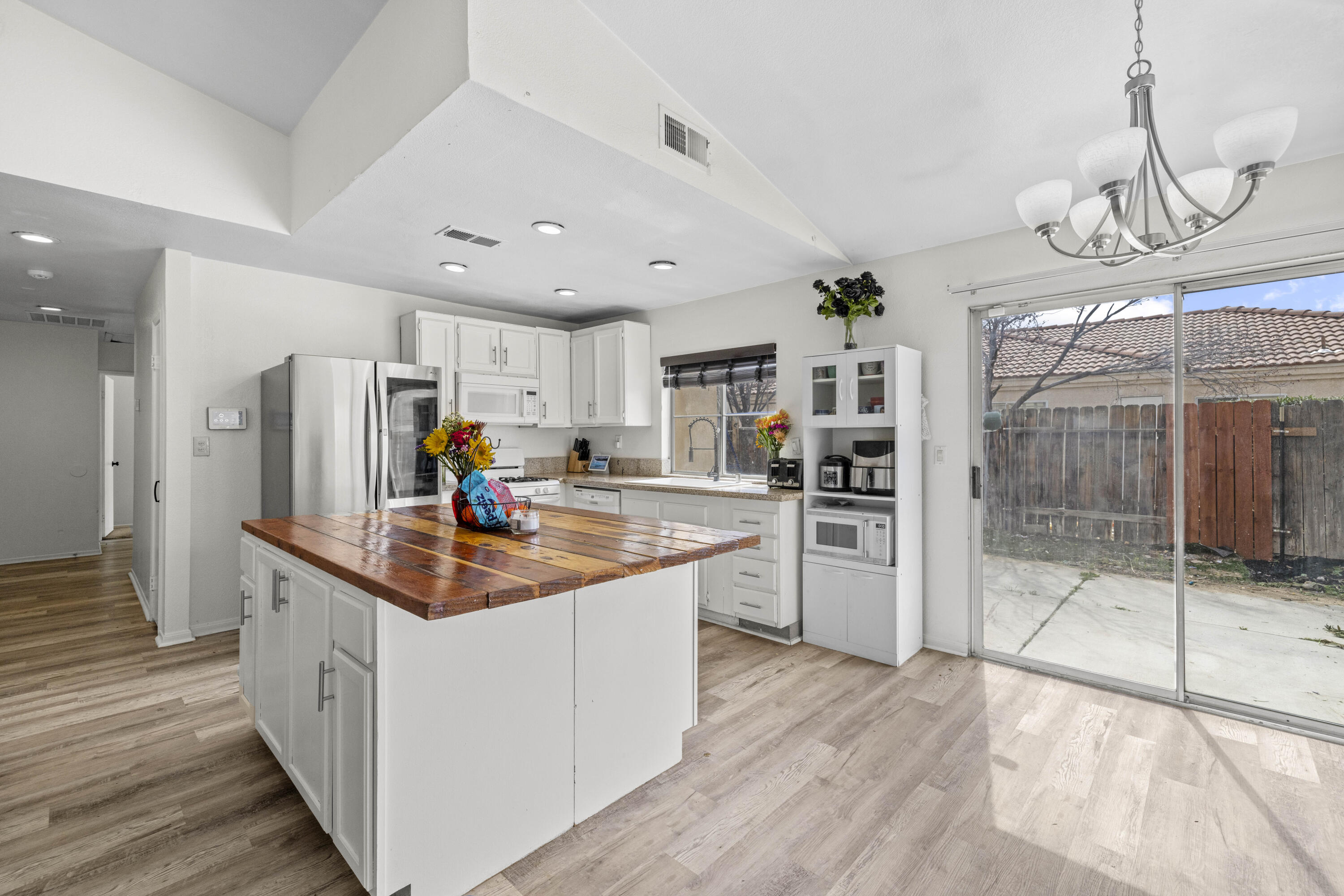 40131 La Cota Drive Palmdale, CA 93550 - Photo 11 of 26 a kitchen with stainless steel appliances granite countertop a sink and cabinets