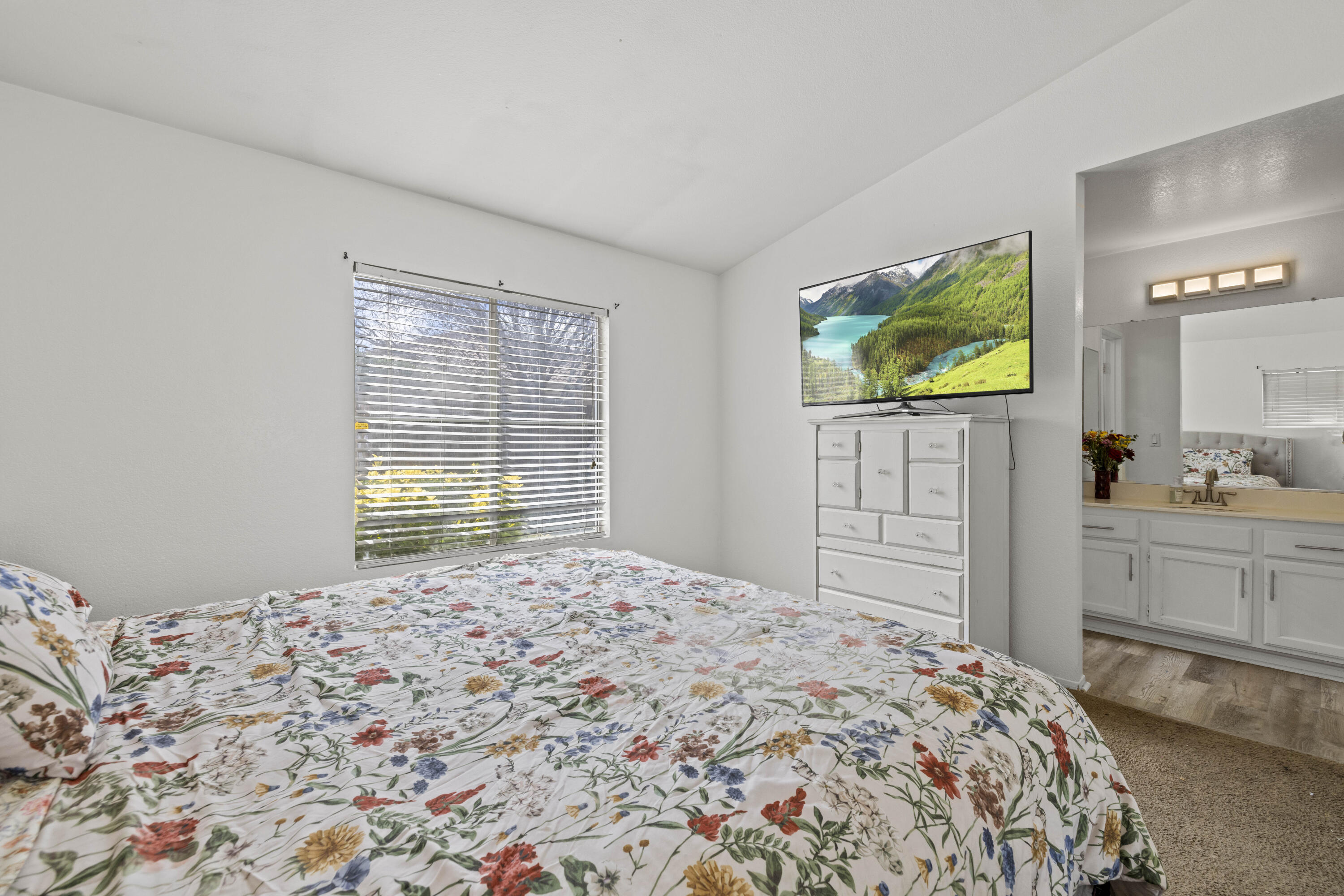 40131 La Cota Drive Palmdale, CA 93550 - Photo 14 of 26 a bedroom with a bed and a flat screen tv