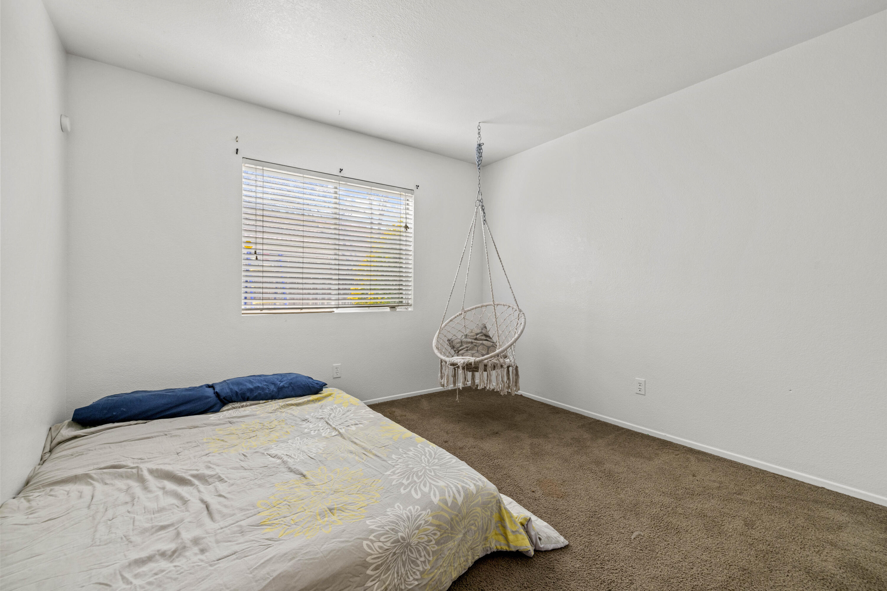 40131 La Cota Drive Palmdale, CA 93550 - Photo 17 of 26 a bedroom with a bed and a window