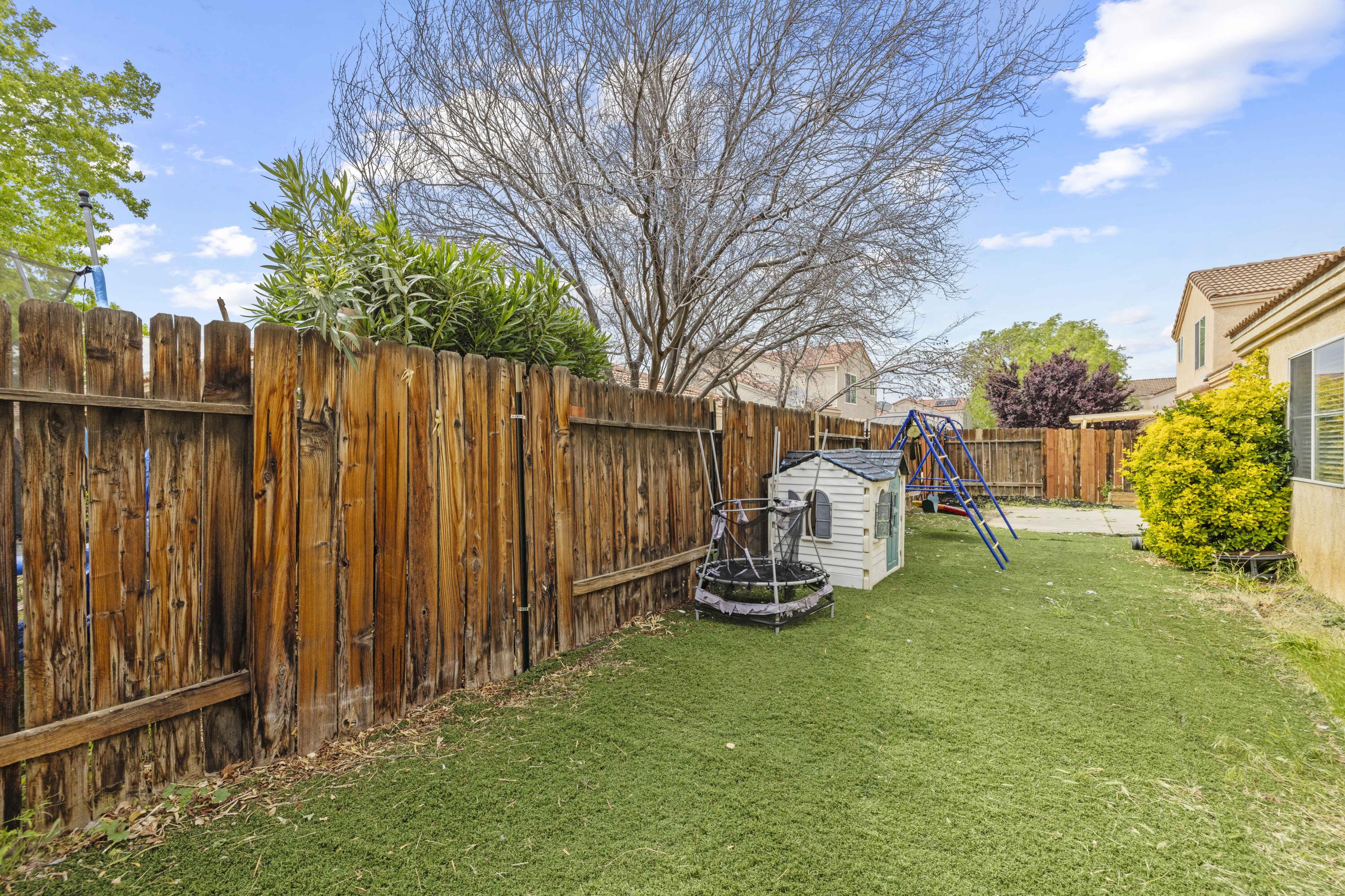 40131 La Cota Drive Palmdale, CA 93550 - Photo 19 of 26 a view of a backyard with wooden fence