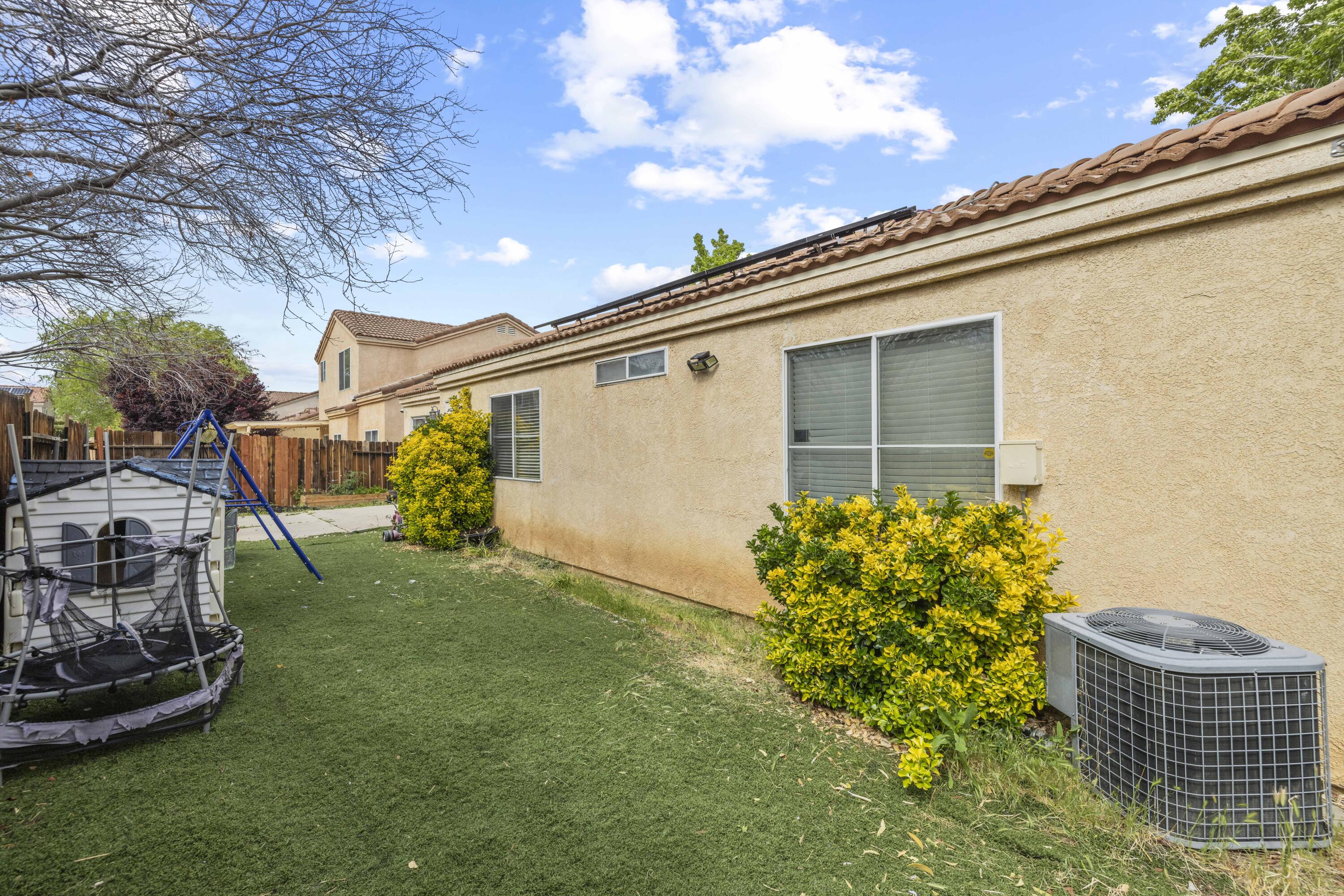 40131 La Cota Drive Palmdale, CA 93550 - Photo 20 of 26 a front view of a house with garden