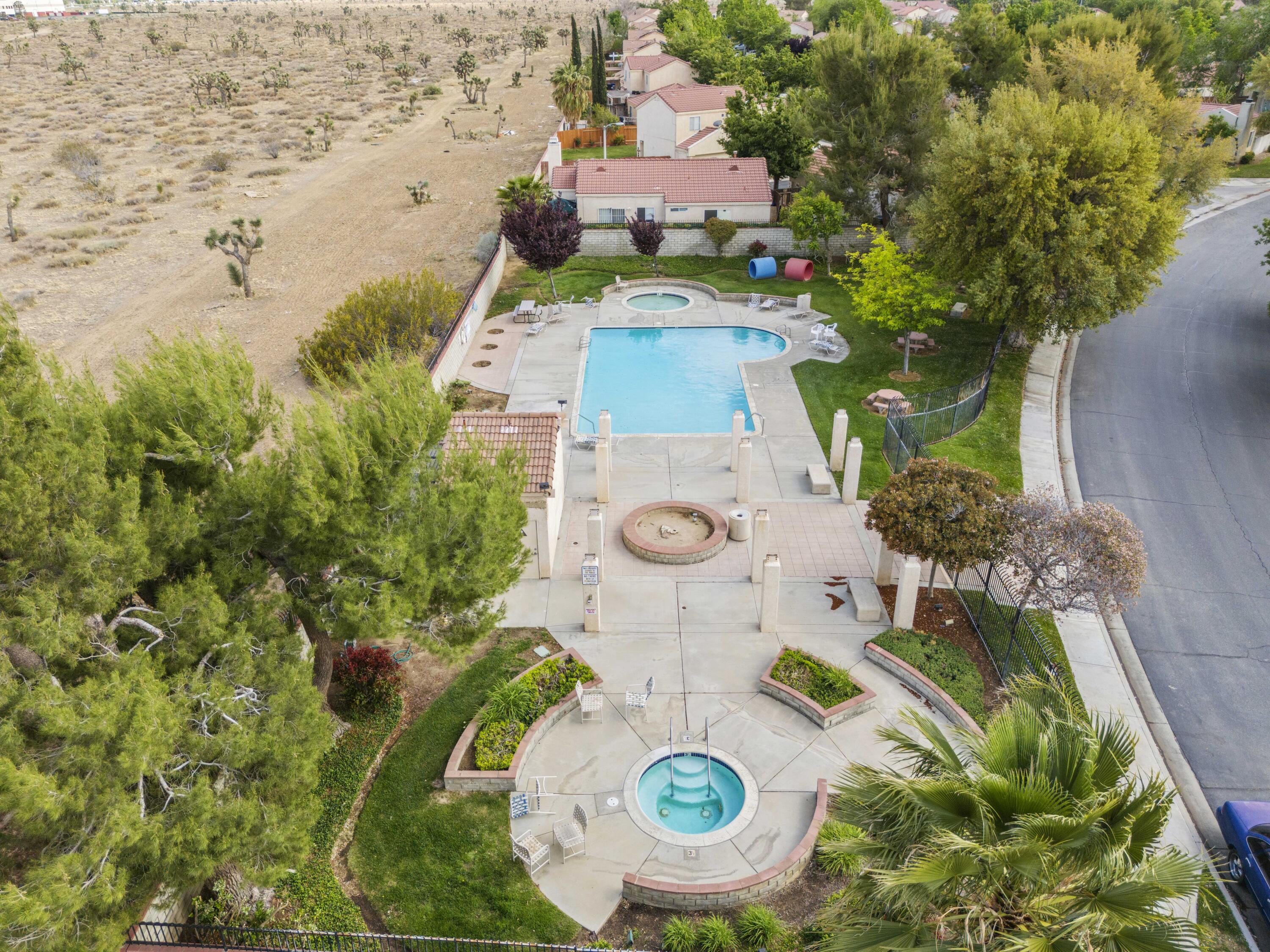 40131 La Cota Drive Palmdale, CA 93550 - Photo 25 of 26 an aerial view of a house with a swimming pool