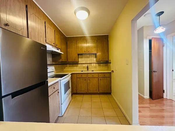 a kitchen with a sink cabinets and stainless steel appliances