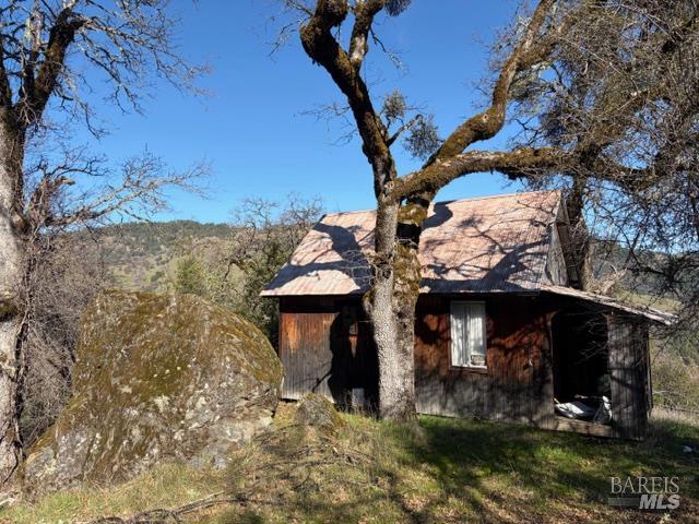58921 George Washington Rock Road Leggett, CA 95585 - Photo 2 of 13 a view of a house with a yard