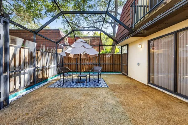 a view of outdoor space with table and chairs