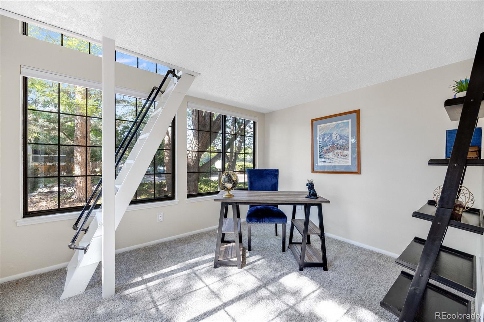 4811 White Rock Circle, Unit C Boulder, CO 80301 - Photo 11 of 19 a view of a livingroom with furniture staircase and a window