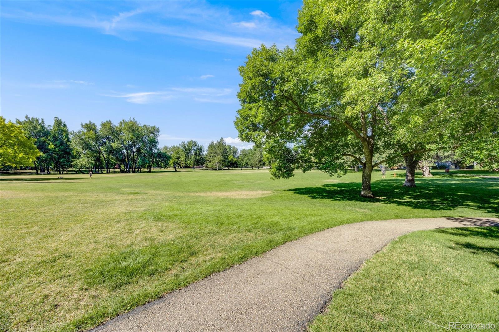 4811 White Rock Circle, Unit C Boulder, CO 80301 - Photo 16 of 19 a view of a grassy field with trees