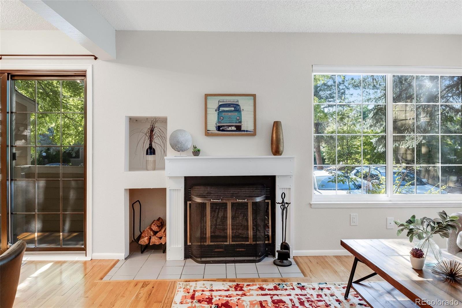 4811 White Rock Circle, Unit C Boulder, CO 80301 - Photo 5 of 19 a living room with a fireplace and a floor to ceiling window