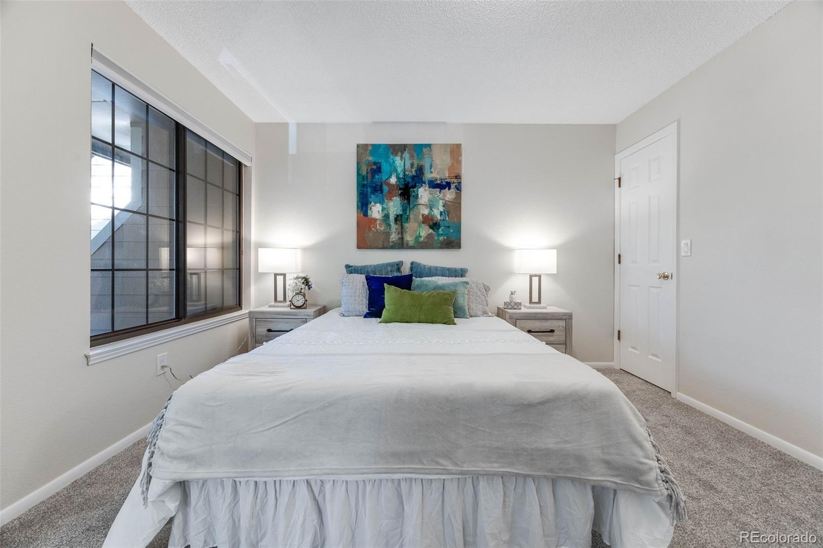 4811 White Rock Circle, Unit C Boulder, CO 80301 - Photo 8 of 19 a bedroom with a large bed and a window