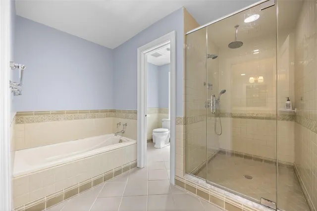 a kitchen with a refrigerator and a sink