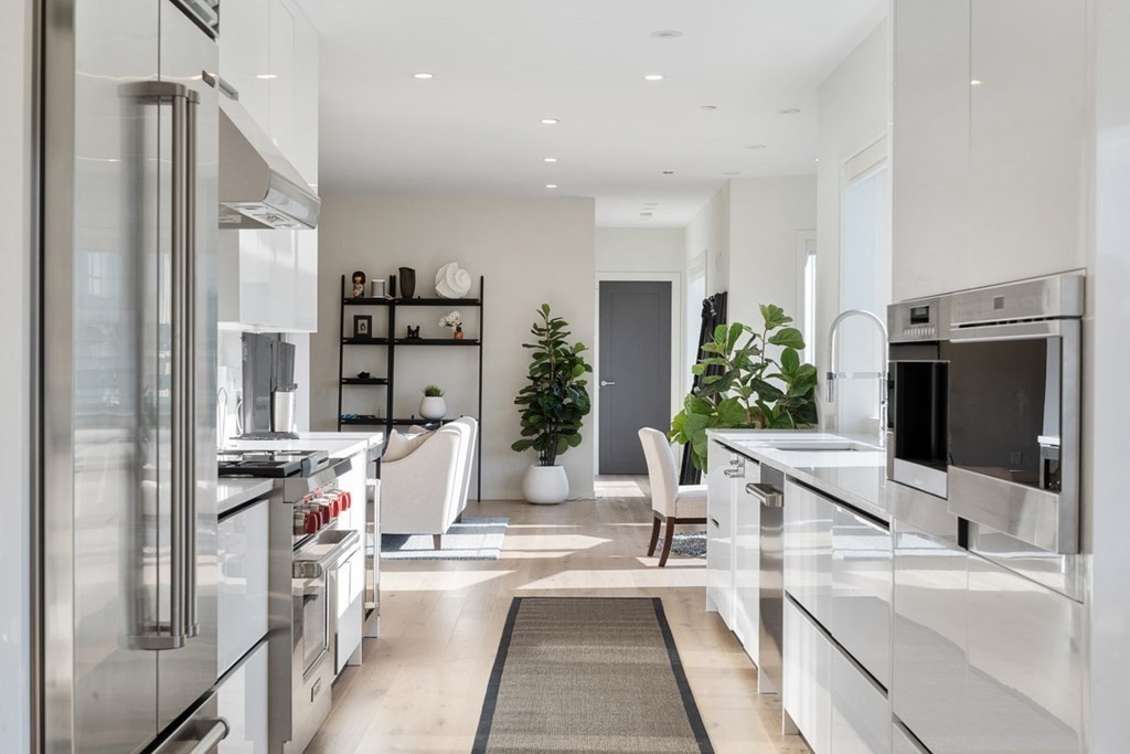 100 A Street, Unit 6 Boston, MA 02127 - Photo 11 of 37 a view of living room with furniture and large windows